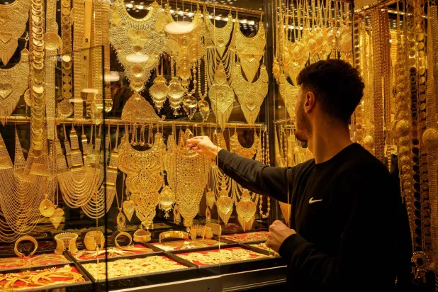 Gold Rises as Traders Reassess Positions after Fed Rate Hike, Oil Rally Eases