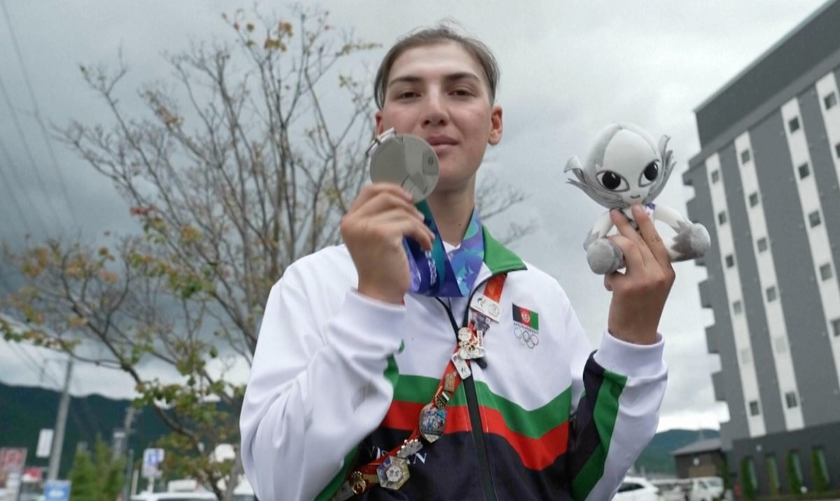 Afghan female cyclist wins silver at Asian Games after disguising herself as a man to train