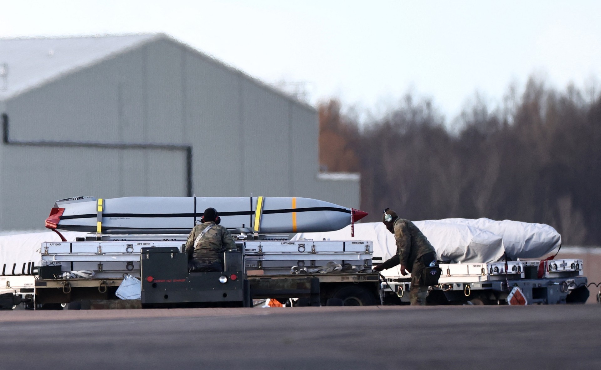 Police evacuate homes near US air base in England and detain men on suspected explosives offensives