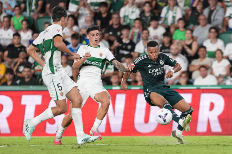 Real Madrid pulls off late La Liga win after squandering 2-goal lead at Elche. Mbappé scores again