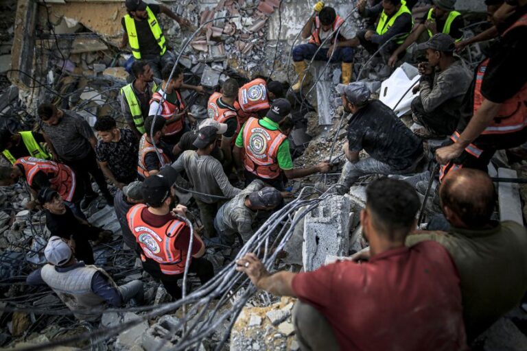 Gaza building collapse kills more than 20, dozens remain trapped under rubble
