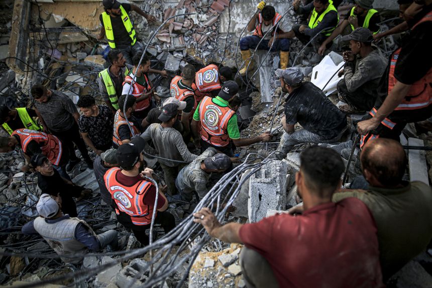 Gaza building collapse kills more than 20, dozens remain trapped under rubble