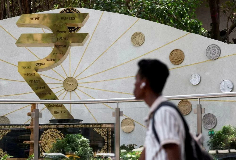 India unveils tough curbs on dollar demand to defend rupee