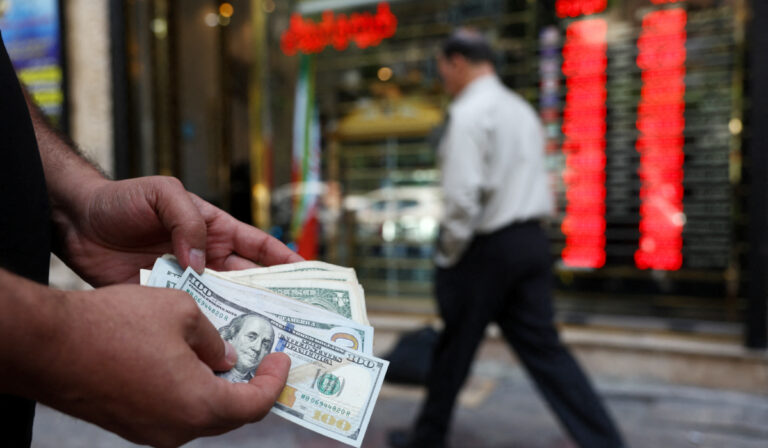Iranian rial at new low, as central bank sells dollars to support currency
