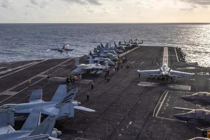 Pentagon chief visits carrier returning from tough Iran war deployment