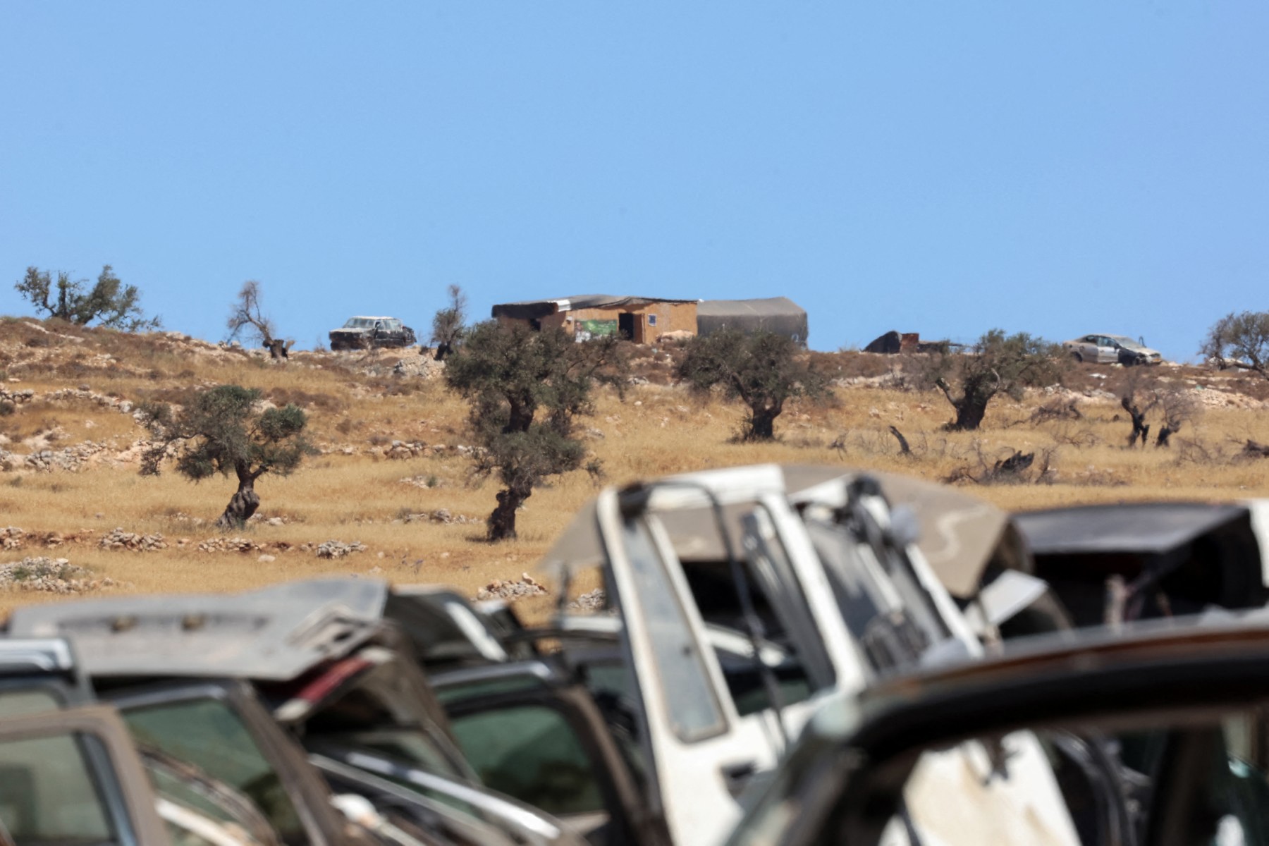 Israeli settlers torch Palestinian welcome sign amid olive harvest violence