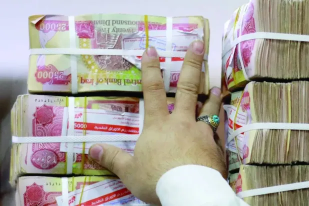 Iraq Central Bank Devalues Dinar after Mideast War Hurts Oil Exports