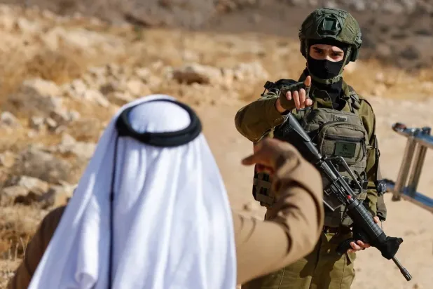 Palestinians Await Announcement of Election Postponement