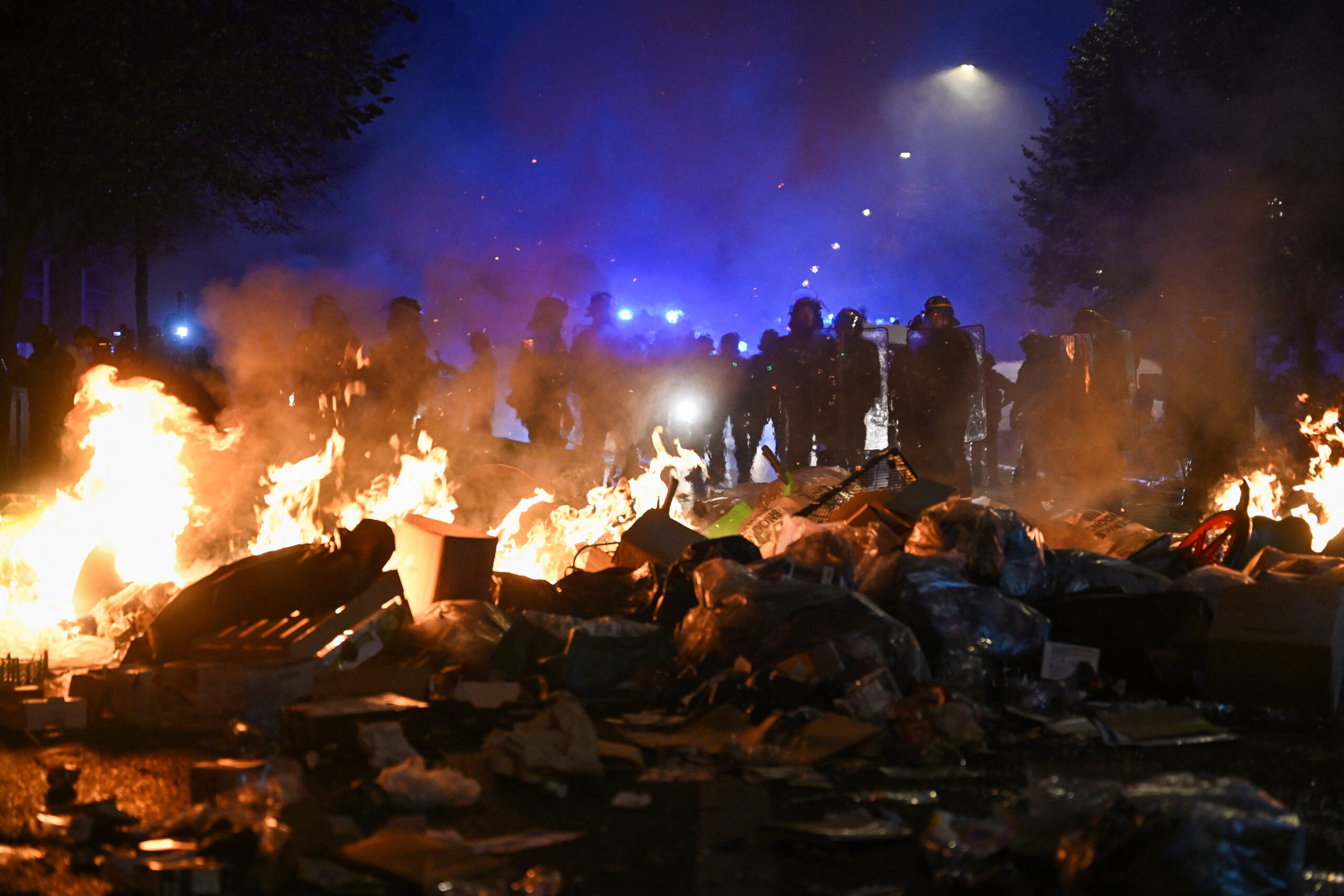 Paris imposes nighttime curfew and protest ban after violent unrest