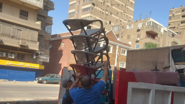 رفع الإشغالات المخالفة وإزالة التعديات بشوارع العجوزة خلال حملات مكبرة